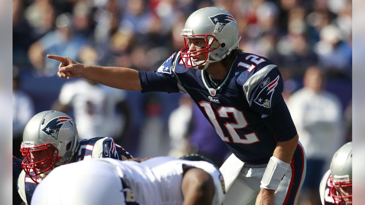 New England Patriots quarterback Tom Brady (12) calls a play in the huddle  in the first quarter against the New York Jets at Gillette Stadium in  Foxboro, Massachusetts on December 6, 2010.