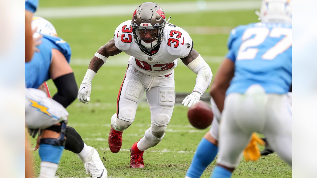 TAMPA, FL - OCTOBER 04: Jordan Whitehead (33) and Devin White (45) of the  Buccaneers celebrates a defensive stop during the regular season game  between the Los Angeles Chargers and the Tampa