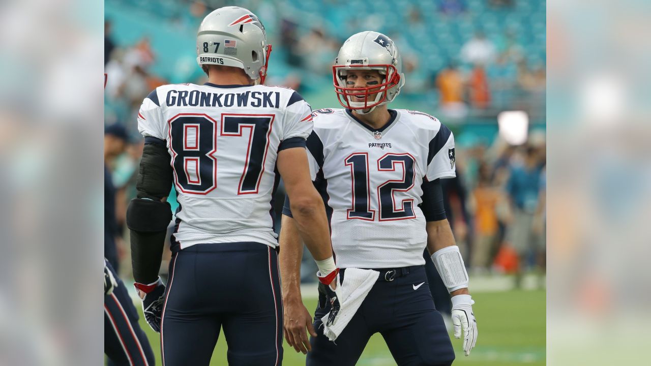 Tom Brady takes batting practice with Rob Gronkowski