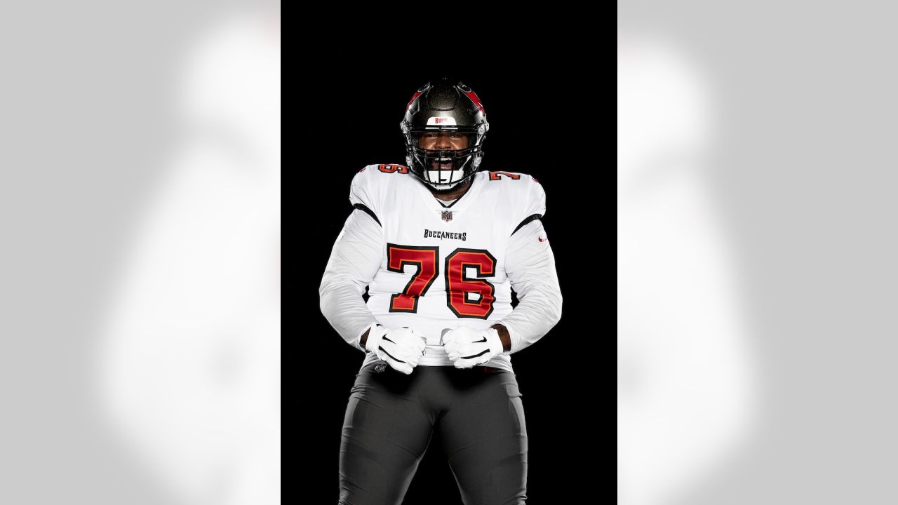 Tampa Bay Buccaneers offensive guard Alex Cappa (65) sits on the bench  during the first half of an NFL football game against the Dallas Cowboys,  Thursday, Sept. 9, 2021, in Tampa, Fla. (