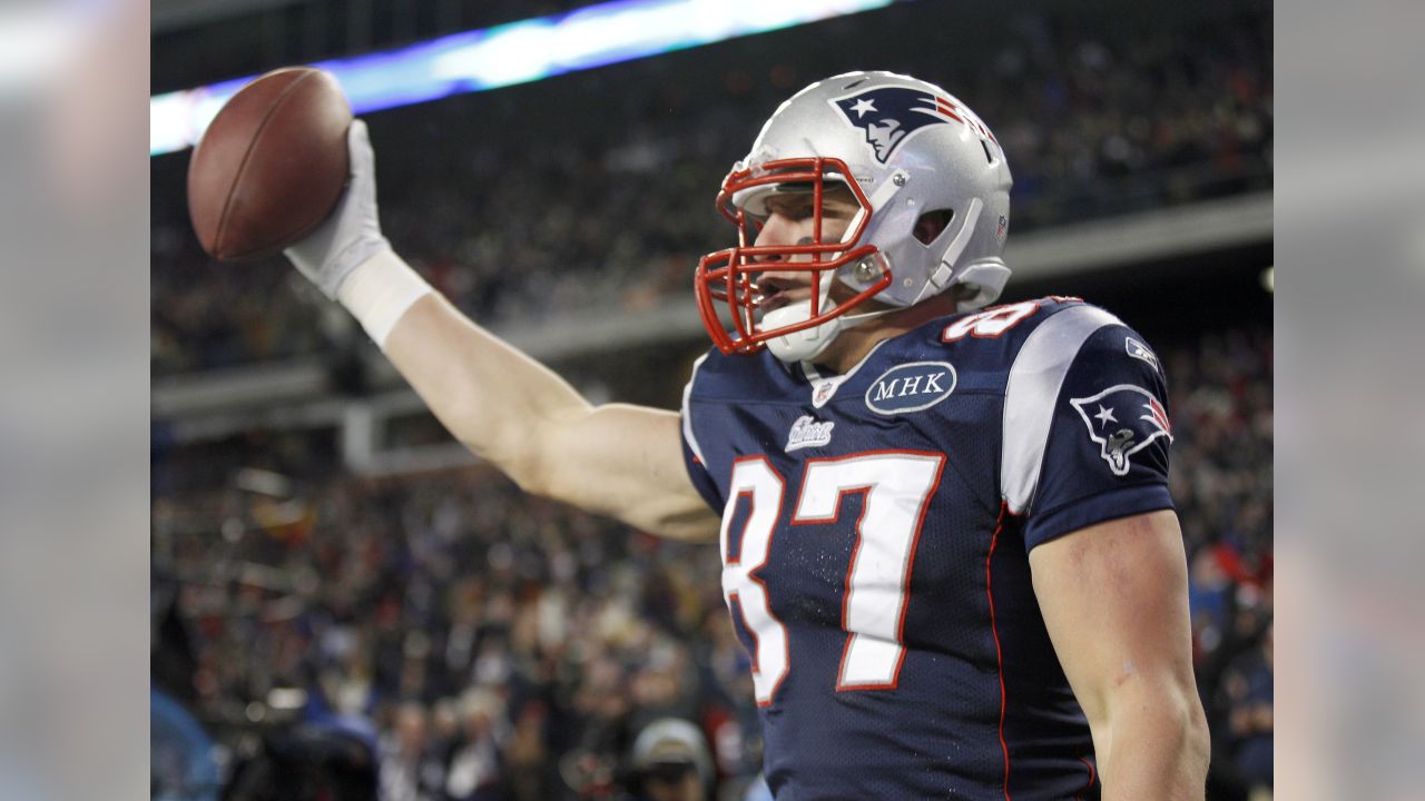 New England Patriots tight end Rob Gronkowski (87) finds open running room  against the Broncos on Sunday evening