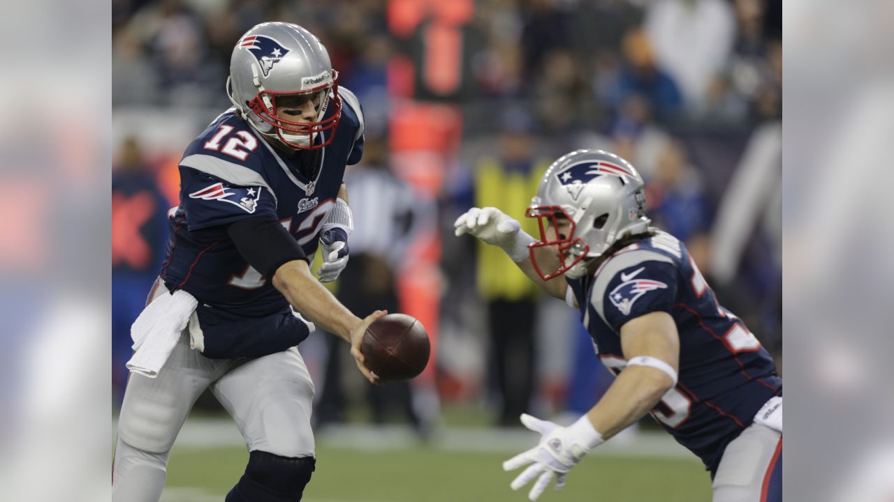 Jan 19, 2002; Foxboro, MA, USA; New England Patriots quarterback Tom Brady,  #12, releases the ball in the 4th qt. against the Oakland Raiders during  their AFC playoff game on Saturday, January