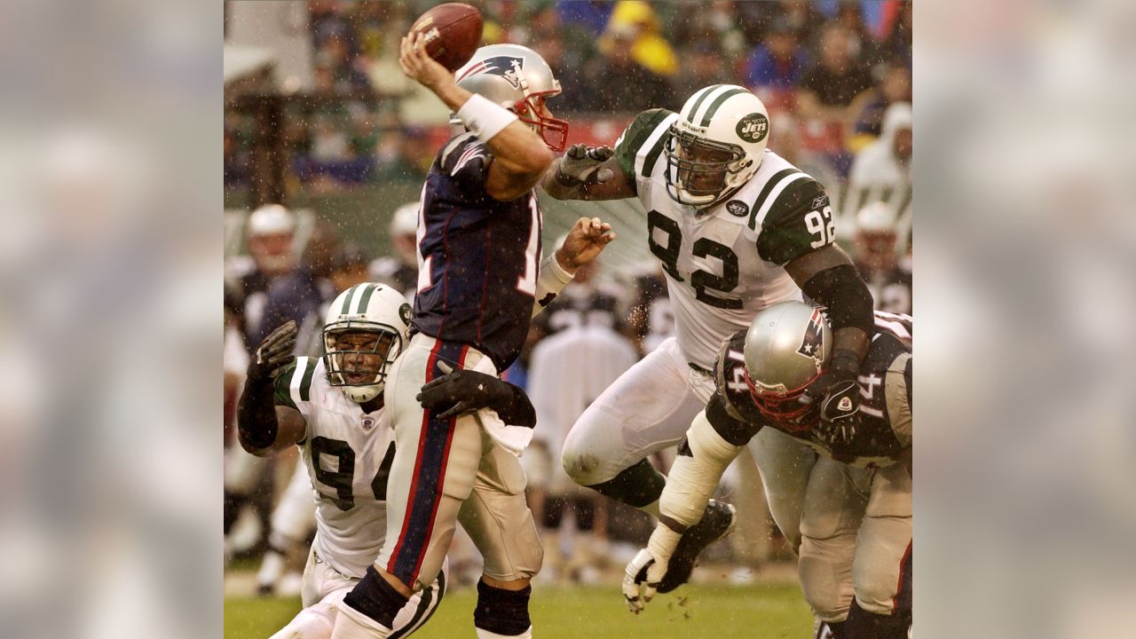 New England Patriots quarterback Tom Brady is pressured by New York Jets  Shaun Ellis in the fourth quarter of week 2 of the NFL season at Giants  Stadium in East Rutherford, New