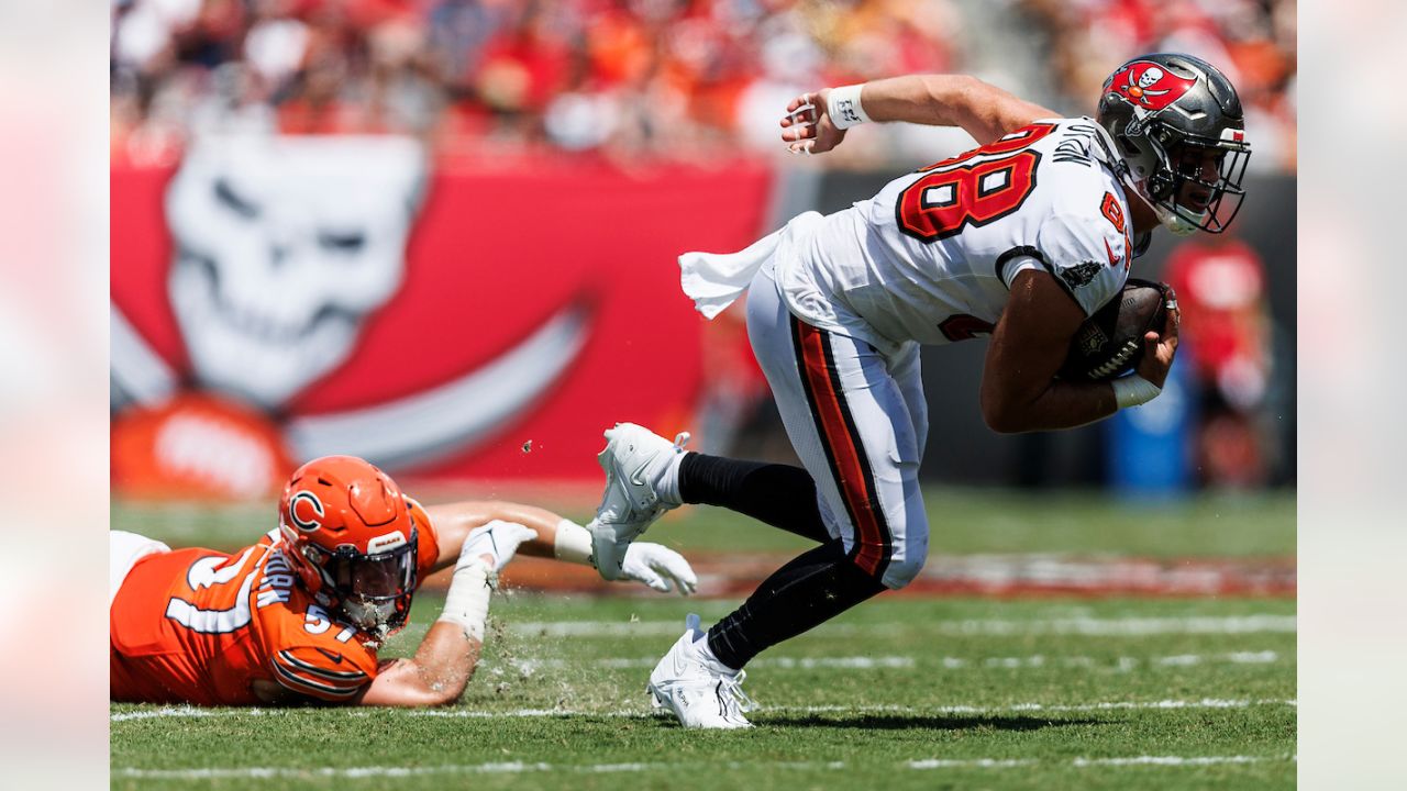 Tampa Bay Buccaneers tight end Cade Otton (88) runs after the