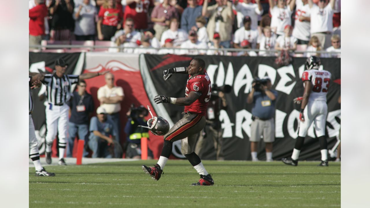 Tampa Bay Buccaneers' Simeon Rice (97) talks with Derrick Brooks before  halftime against the Kansas City Chiefs at Raymond James Stadium Nov. 7,  2004 in Tampa, Florida. The Buccaneers beat the Chiefs