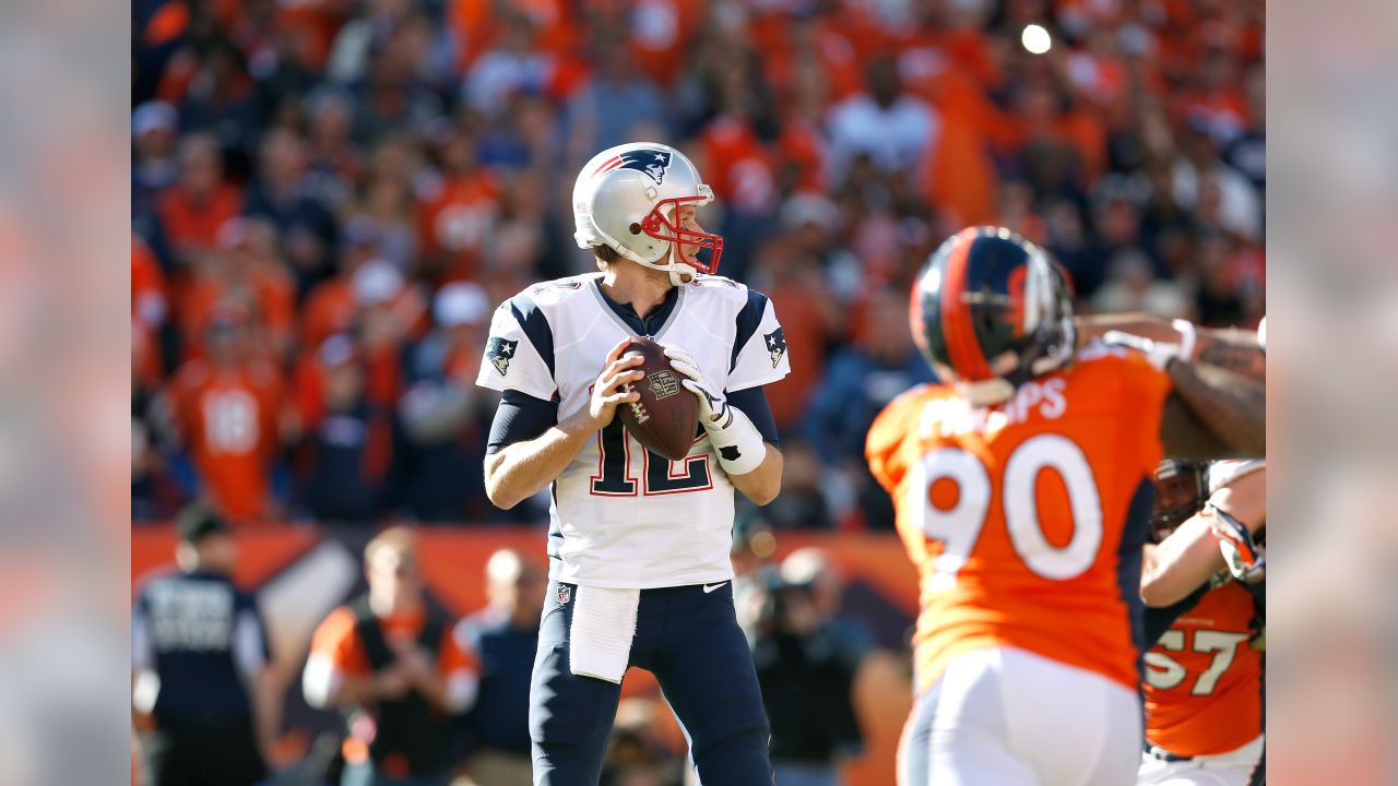 Tom Brady (12) of the New England Patriots throws a pass during the AFC  Championship game at Sports Authority Field at Mile High in Denver on  January 19, 2014. The New England-Denver