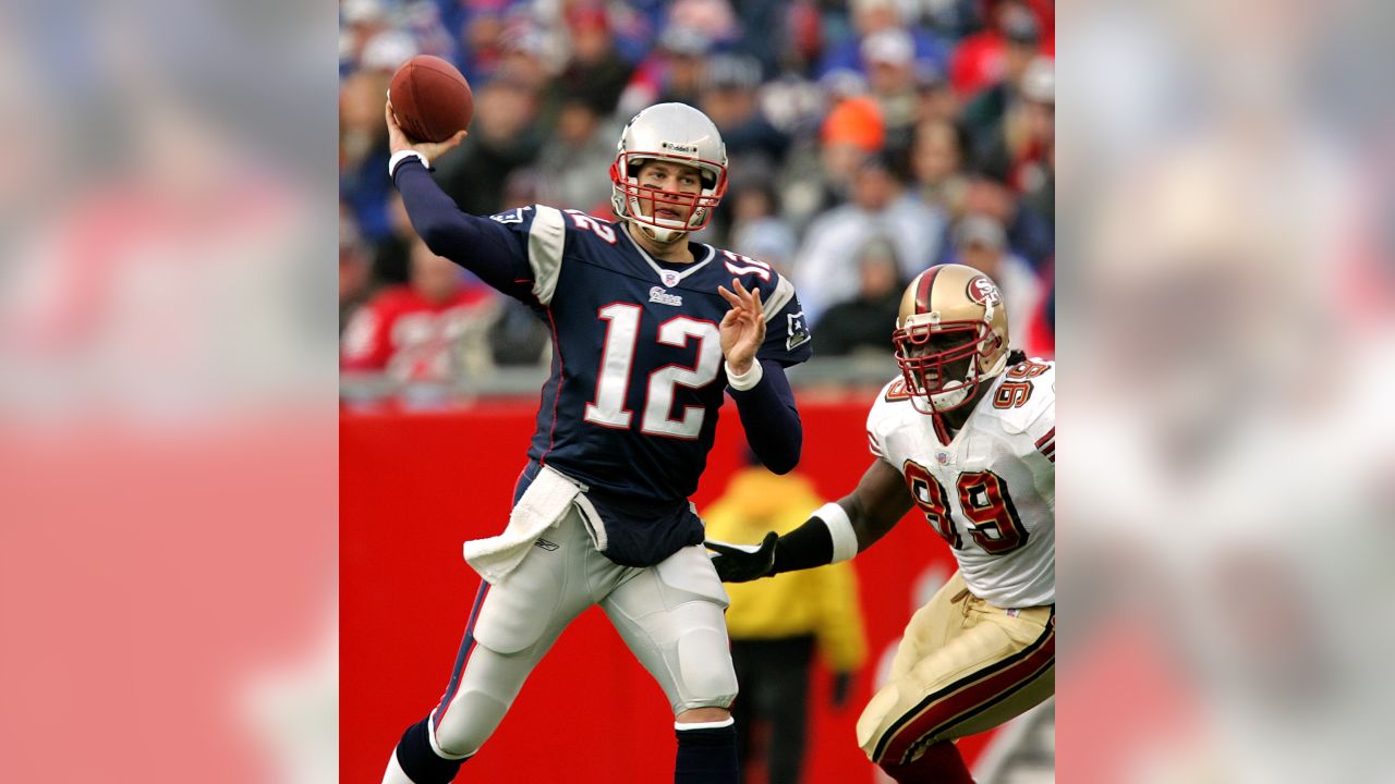 New England Patriots quarterback Tom Brady (12) waits to run onto the field  with his teammates during team introductions before an NFL football game  against the Tampa Bay Buccaneers Thursday, Oct. 5