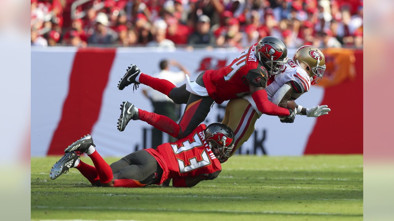 Tampa Bay Buccaneers' William Gholston (92) talks with Tampa Bay Buccaneers'  Rakeem Nunez-Roches (56) before