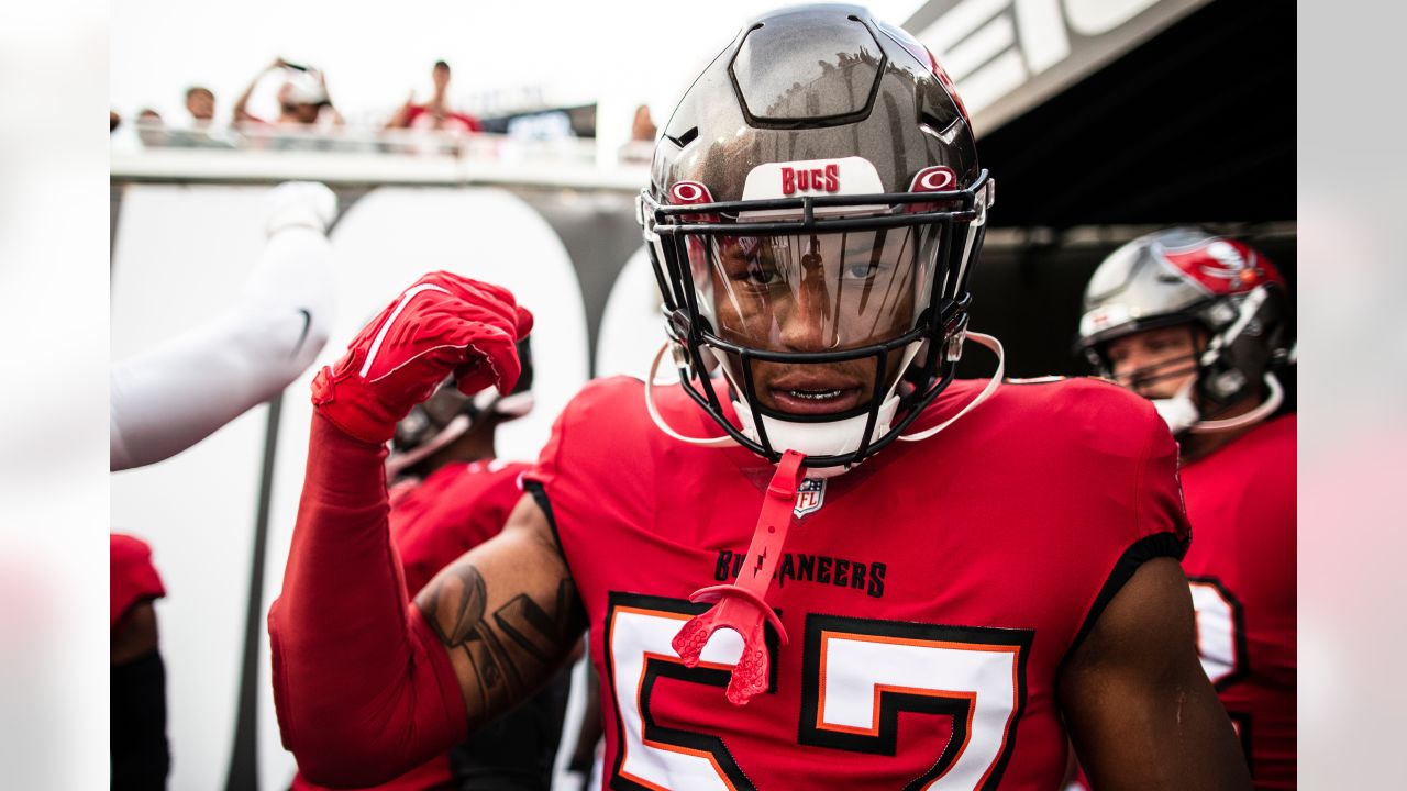 Tampa Bay Buccaneers linebacker Joe Tryon-Shoyinka (9) stretches out prior  to an NFL football game against the New England Patriots, Sunday, Oct. 3,  2021, in Foxborough, Mass. (AP Photo/Greg M. Cooper Stock