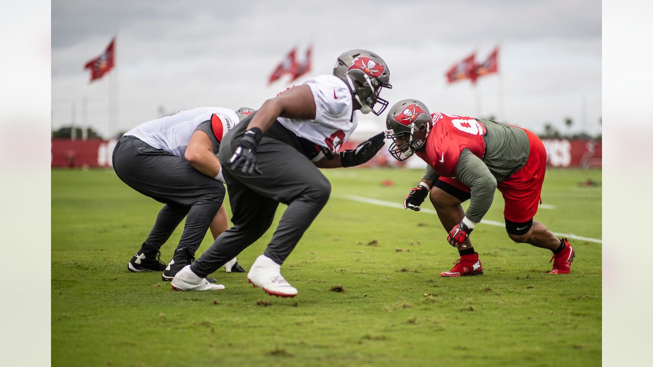 Las Vegas Raiders offensive tackle Sam Young (70) and Las Vegas Raiders  offensive guard Gabe Jackson (66) attempt to block Tampa Bay Buccaneers  defensive end Ndamukong Suh (93) during the first half