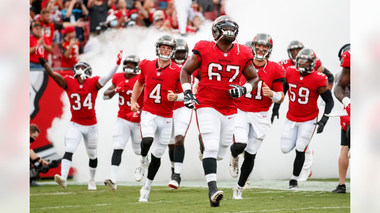 Tampa Bay Buccaneers linebacker Joe Tryon-Shoyinka (9) stretches out prior  to an NFL football game against the New England Patriots, Sunday, Oct. 3,  2021, in Foxborough, Mass. (AP Photo/Greg M. Cooper Stock