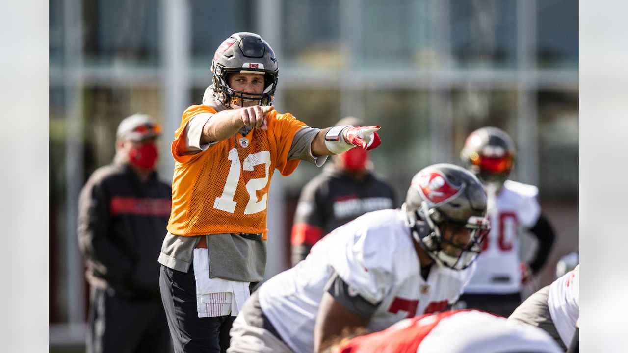 Tampa Bay Buccaneers quarterback Tom Brady (12) throws a pass as offensive  guard Alex Cappa (65 …