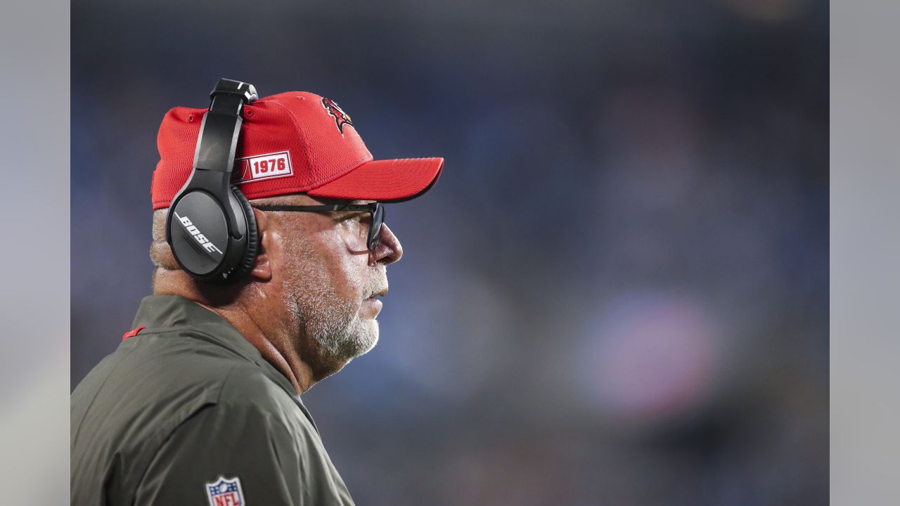 Bruce Arians looks like many things with face shield, headset and hat