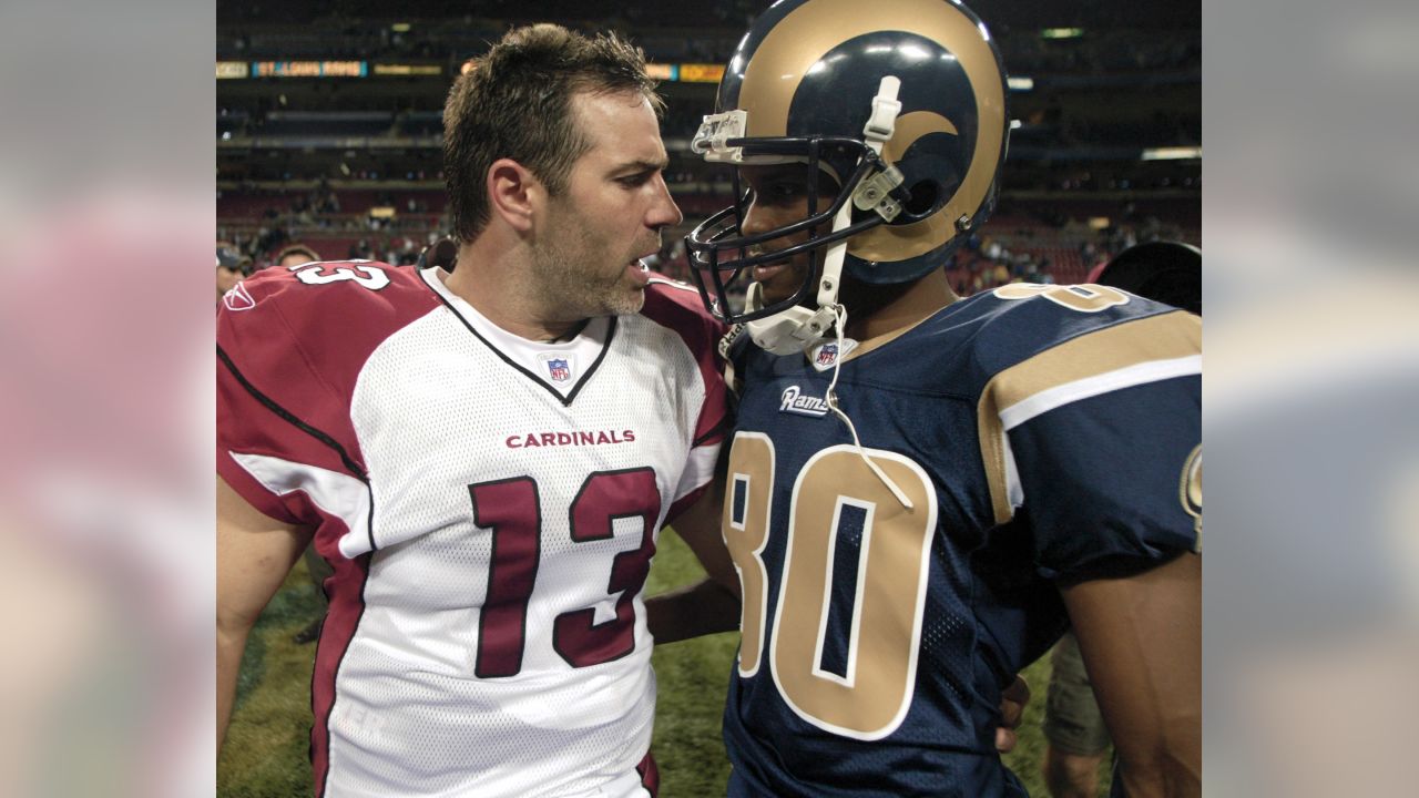 Arizona Cardinals quarterback Kurt Warner (L) talks with former teammate St.  Louis Rams Isaac Bruce, after the Cardinals defeated the Rams 38-28, at the  Edward Jones Dome in St. Louis on November