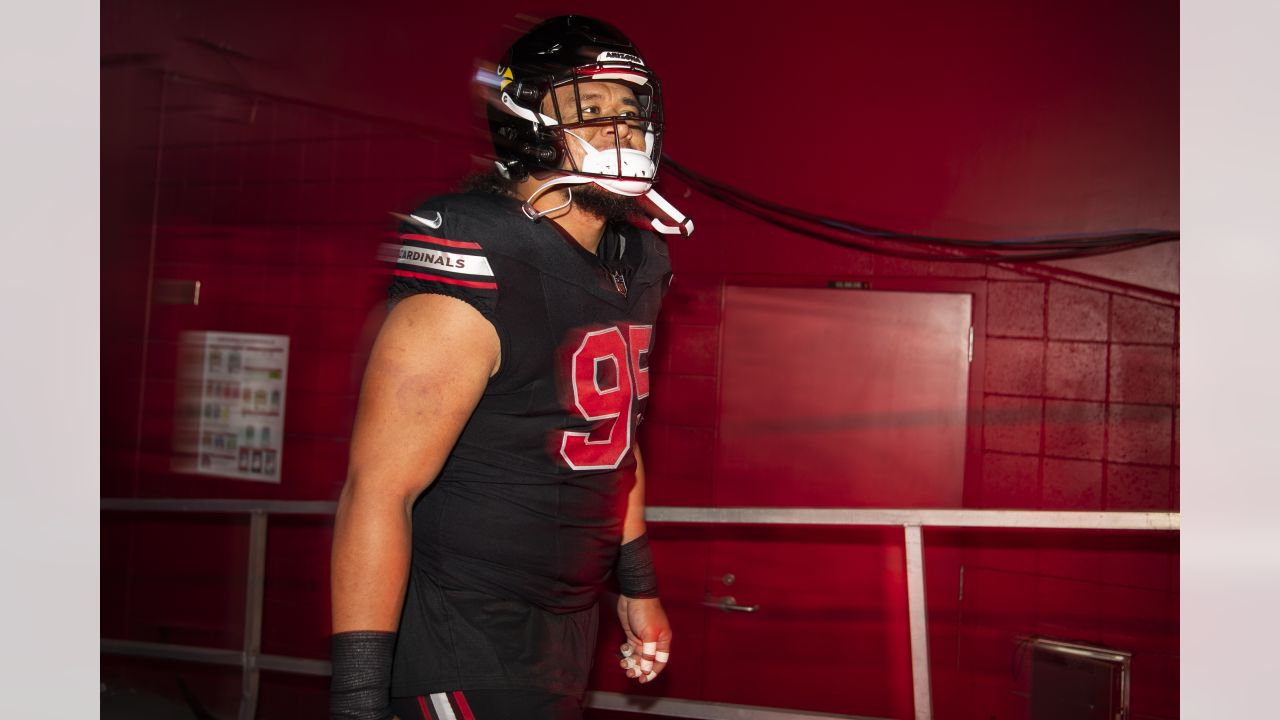 Arizona Cardinals defensive tackle Leki Fotu (95) looks up at a