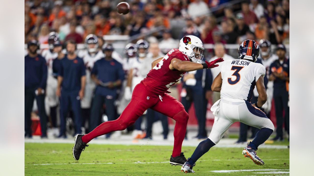 Arizona Cardinals linebacker Myjai Sanders (41) and Cardinals linebacker  Zaven Collins (25) celebrate a defensive stop against the Los Angeles  Chargers during the first half of an NFL football game in Glendale