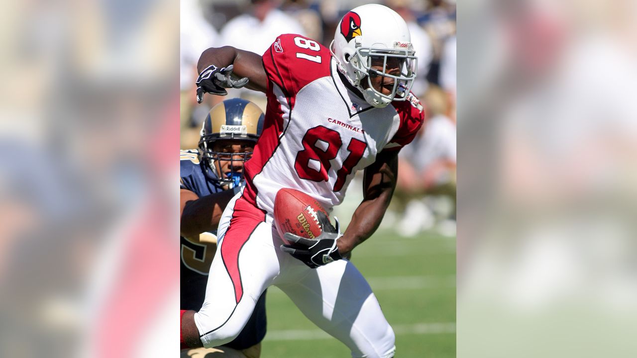 Arizona Cardinals Anquan Boldin slips a tackle by St. Louis Rams