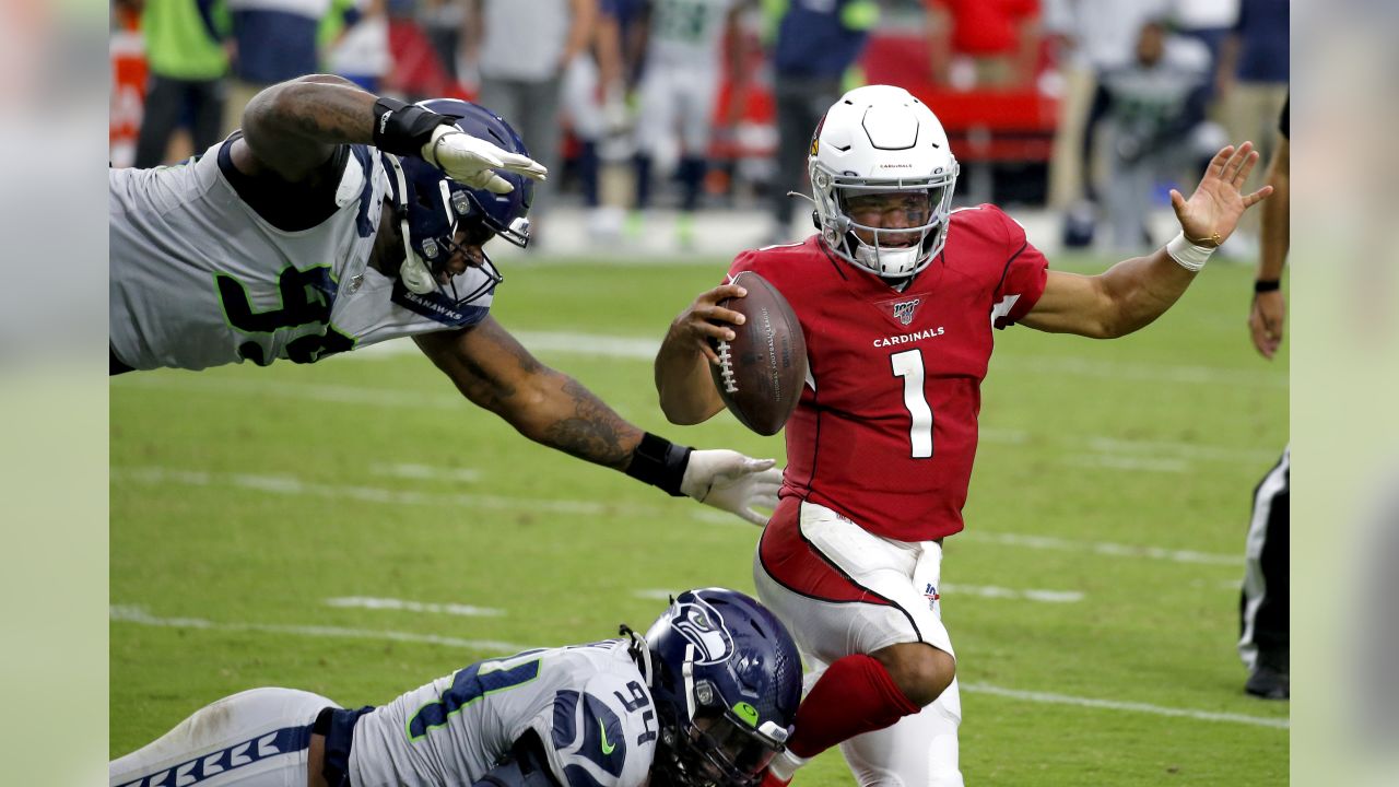 Arizona Cardinals quarterback Kyler Murray (1) scrambles as Seattle  Seahawks defensive end Rasheem Green (98) pursues during the first half of  an NFL football game, Sunday, Sept. 29, 2019, in Glendale, Ariz. (