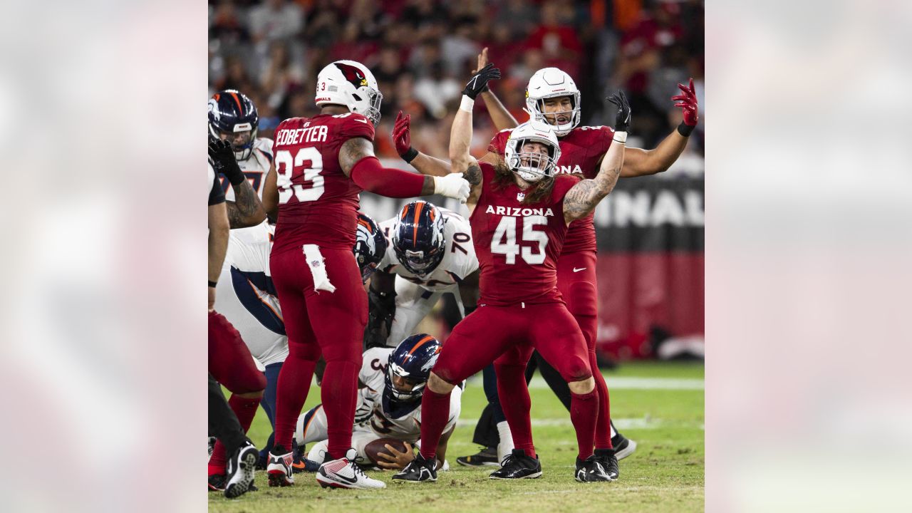 Arizona Cardinals linebacker Myjai Sanders (41) and Cardinals linebacker  Zaven Collins (25) celebrate a defensive stop against the Los Angeles  Chargers during the first half of an NFL football game in Glendale