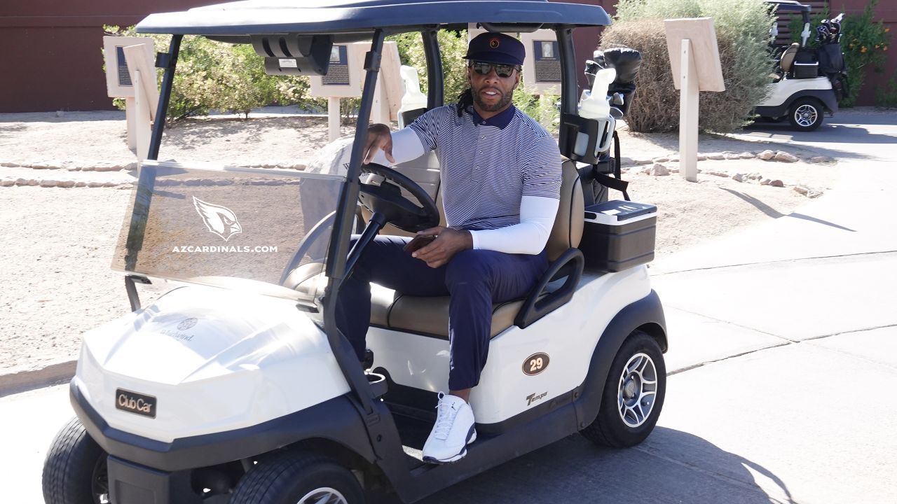 WR Larry Fitzgerald prepares to hit the course