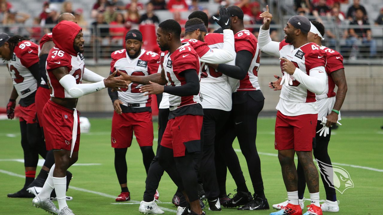 The defense enjoys the moments before the first 11-on-11 play of camp.