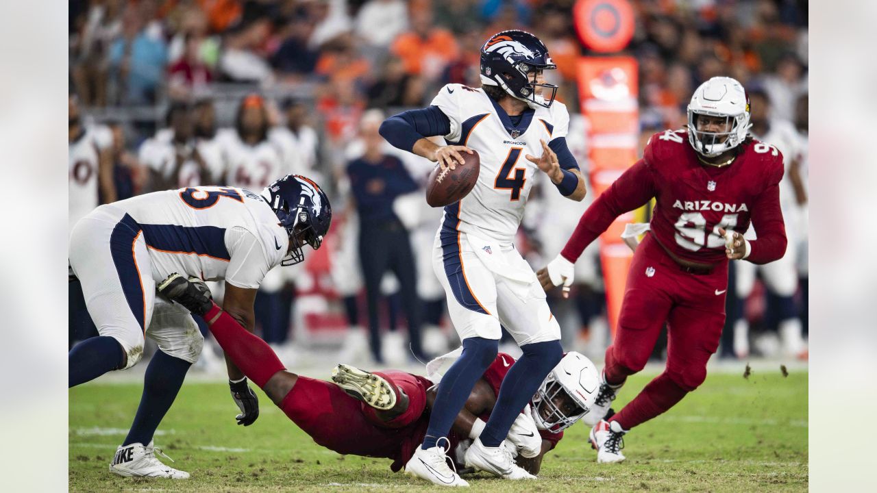 Arizona Cardinals linebacker Myjai Sanders (41) and Cardinals linebacker  Zaven Collins (25) celebrate a defensive stop against the Los Angeles  Chargers during the first half of an NFL football game in Glendale