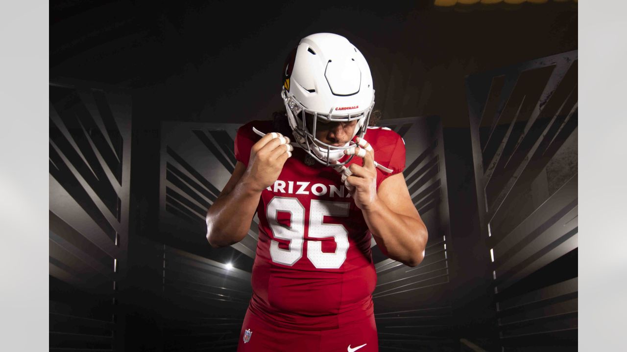 Arizona Cardinals defensive tackle Leki Fotu (95) looks up at a