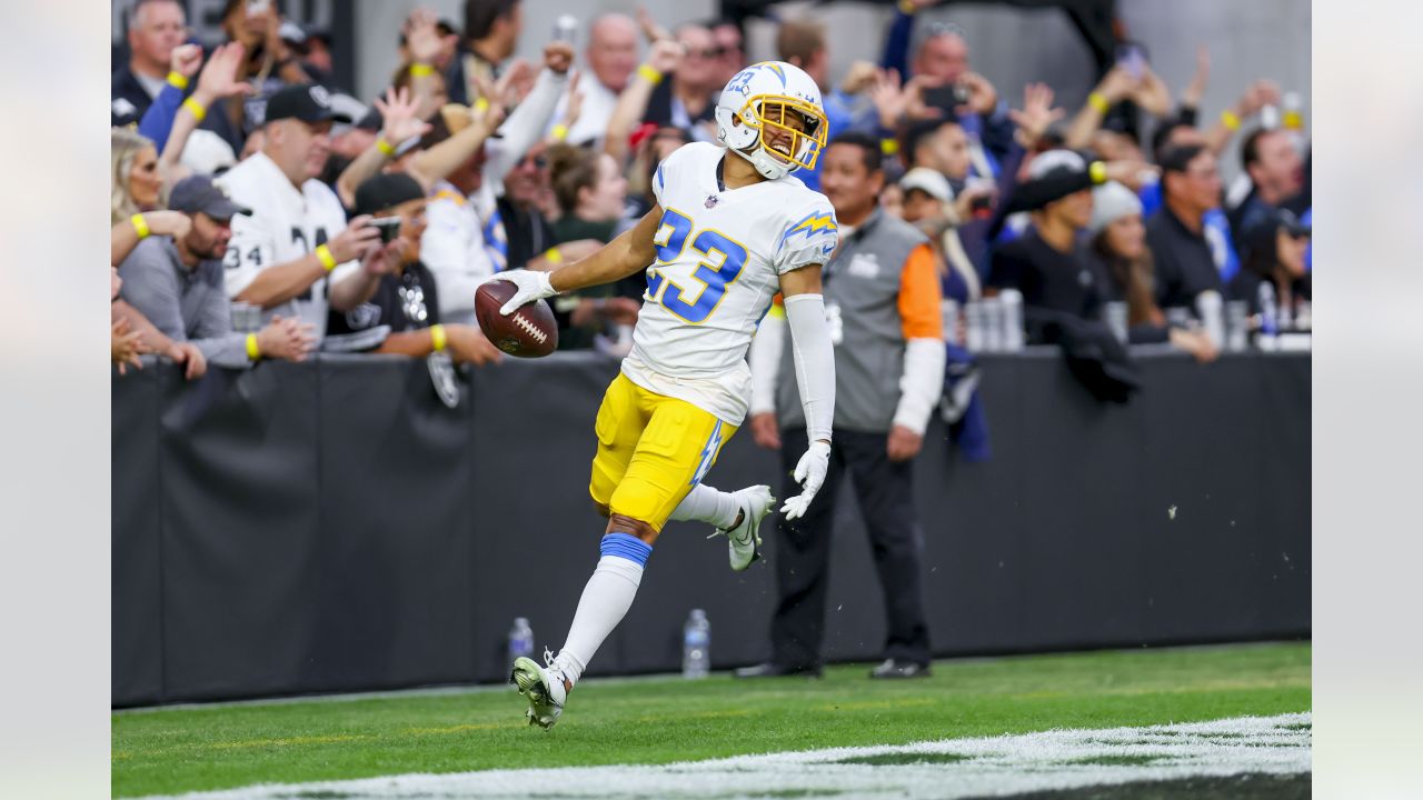 Las Vegas Raiders running back Josh Jacobs (28) gains yards on a run during  an NFL football game against the Los Angeles Chargers, Sunday, September  11, 2022 in Inglewood, Calif. The Chargers