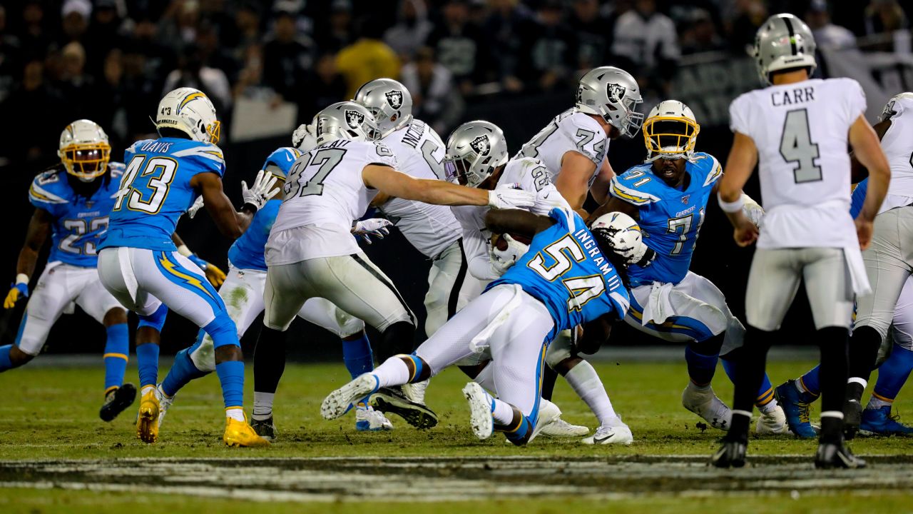 Los Angeles Chargers running back Melvin Gordon (28) runs the ball against  the Oakland Raiders during an NFL football game Sunday, Nov. 11, 2018, in  Oakland, CA. The Chargers won 20-6. (Daniel