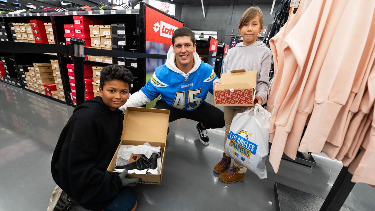 Chargers players join Santa Ana elementary school students for shoe  giveaway – Orange County Register