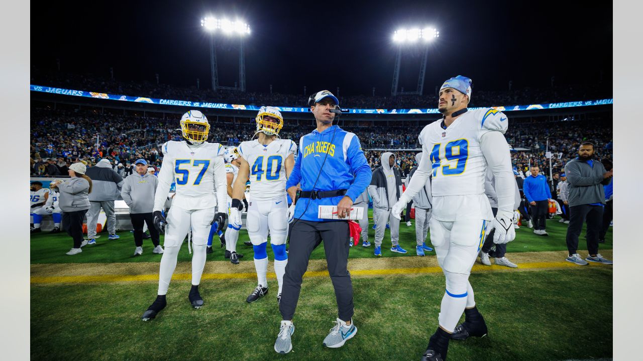 Chargers' Alohi Gilman, Breiden Fehoko, Michael Bandy aided by