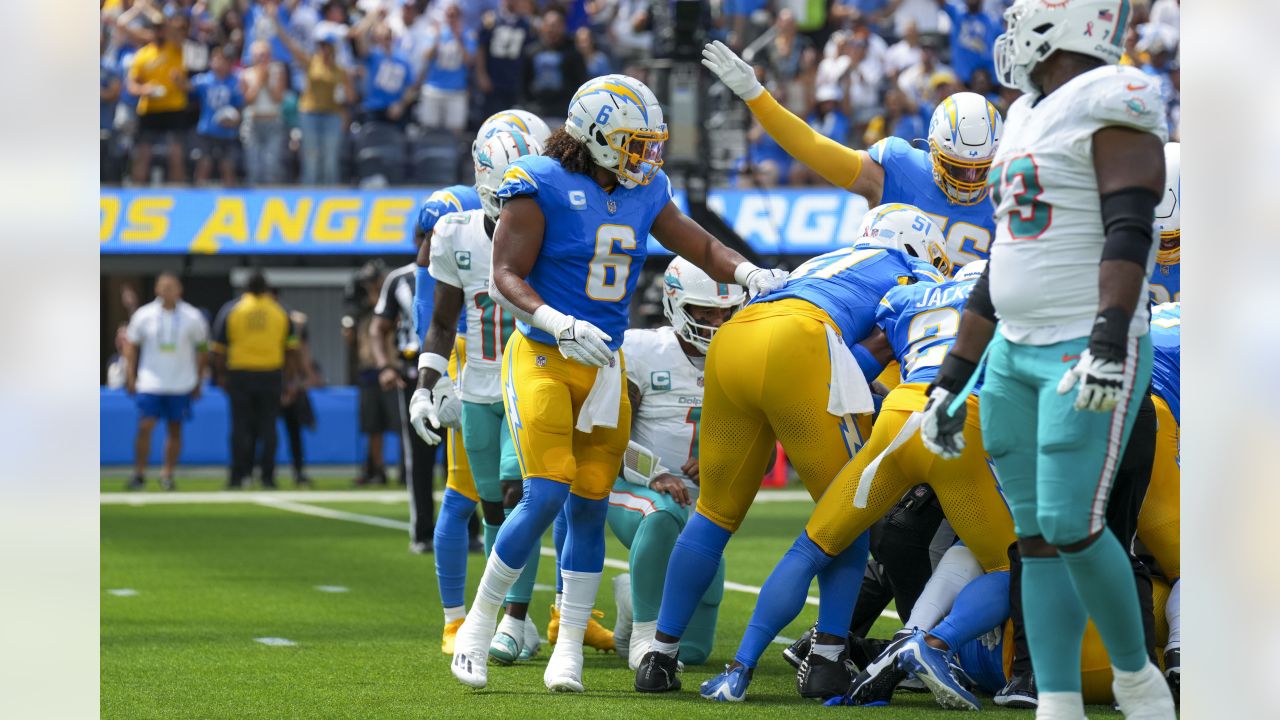 Los Angeles, United States. 10th Sep, 2023. Miami Dolphins quarterback Tua  Tagovailoa (C) runs with the ball fighting off pressure from the Los  Angeles Chargers during an NFL football game. Miami Dolphins