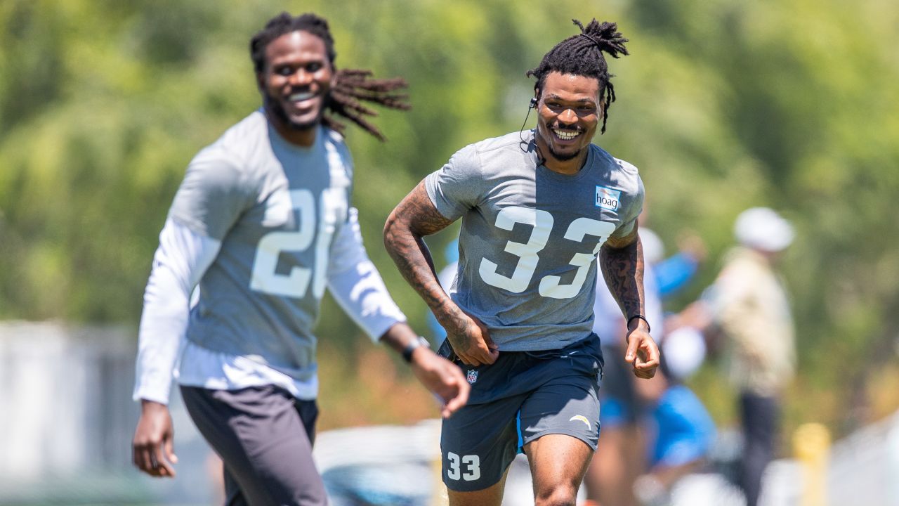 AFC safety Derwin James of the Los Angeles Chargers (33) and AFC  quarterback Justin Herbert of the Los Angeles Chargers (10) interact with  fans during Pro Bowl NFL football practice, Saturday, February