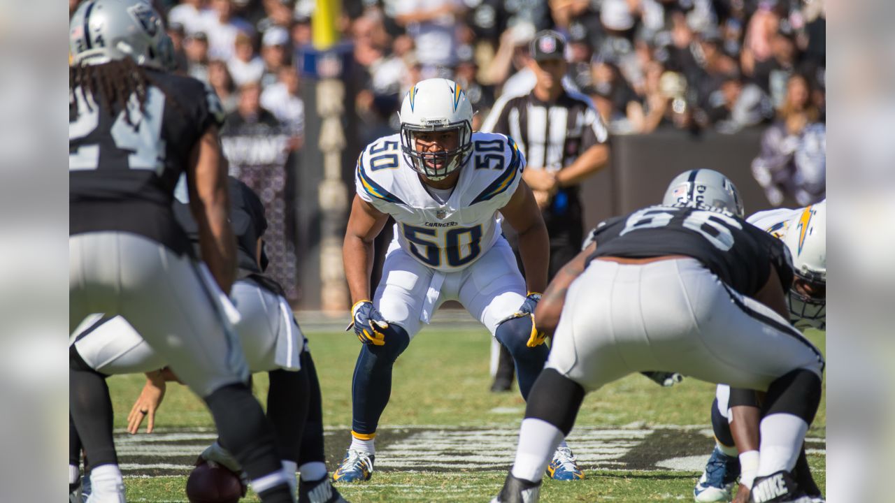 Raiders linebacker Tanner Muse (55) leaps to try and block a pass from  Seattle Seahawks quarter …