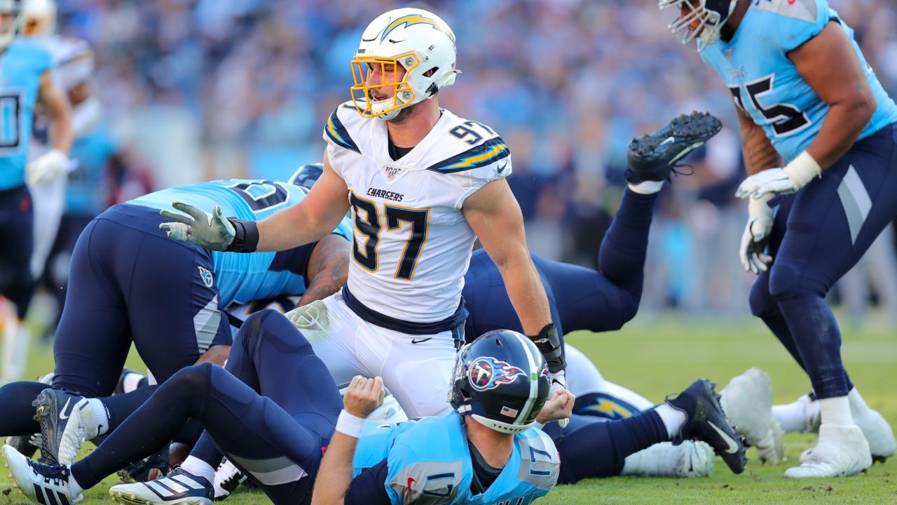 Relieved Chargers hold off Titans to win 33-25 at home