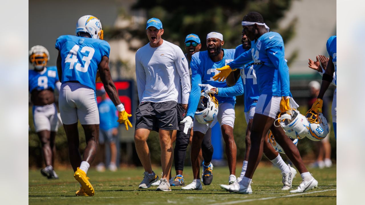 Alohi Gilman of the Los Angeles Chargers celebrates with teammates