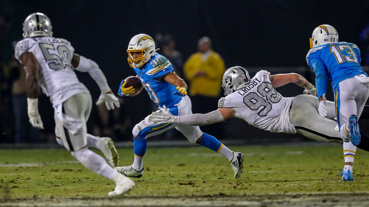 Los Angeles Chargers running back Melvin Gordon (28) runs the ball against  the Oakland Raiders during an NFL football game Sunday, Nov. 11, 2018, in  Oakland, CA. The Chargers won 20-6. (Daniel