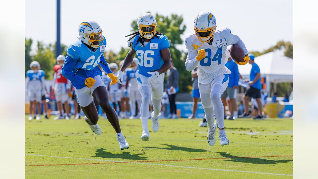 Alohi Gilman of the Los Angeles Chargers celebrates with teammates