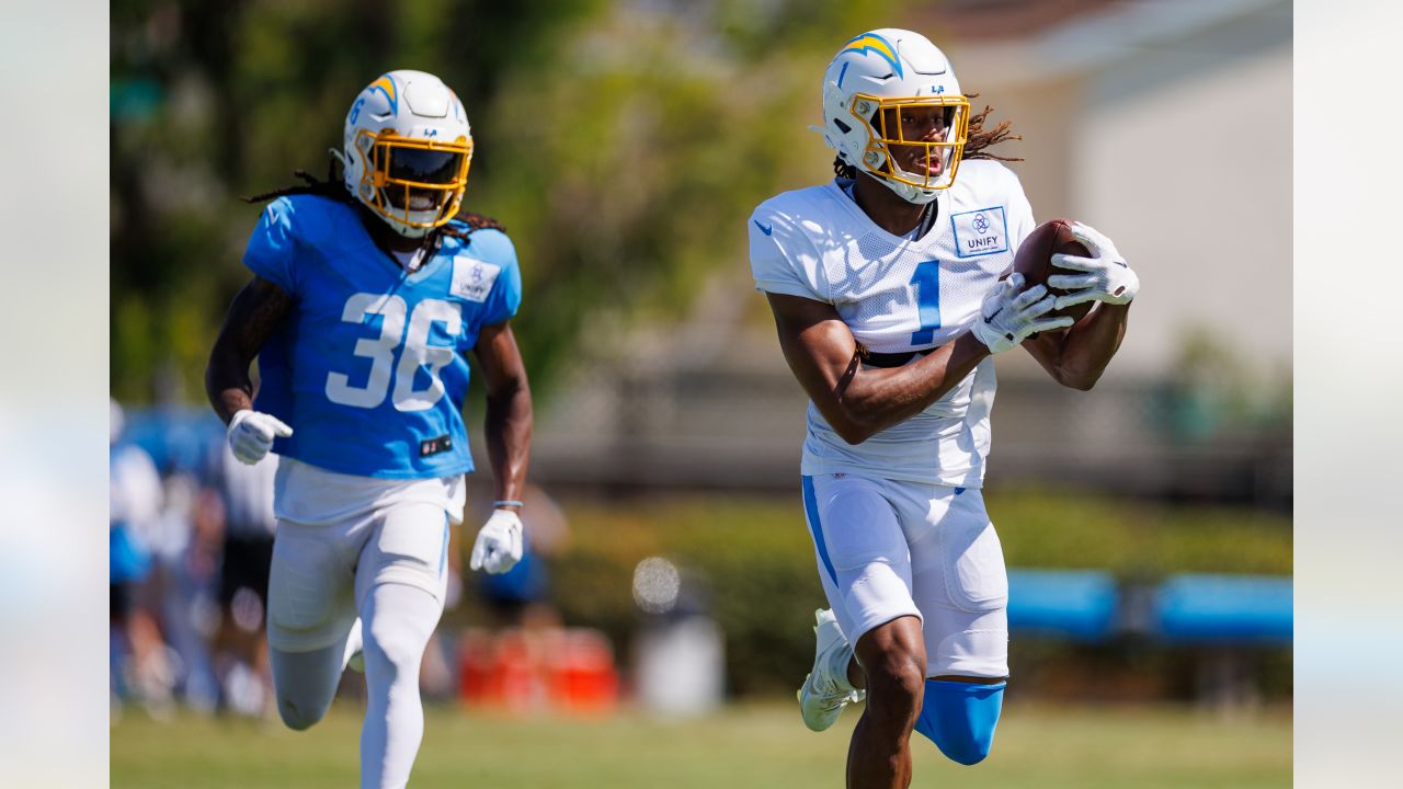 Alohi Gilman of the Los Angeles Chargers celebrates with teammates