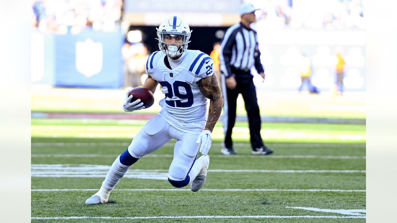 Indianapolis Colts running back Jordan Wilkins (20) runs through an opening  in the line during an NFL football game against the Carolina Panthers,  Sunday, Aug. 15, 2021, in Indianapolis. (AP Photo/Zach Bolinger