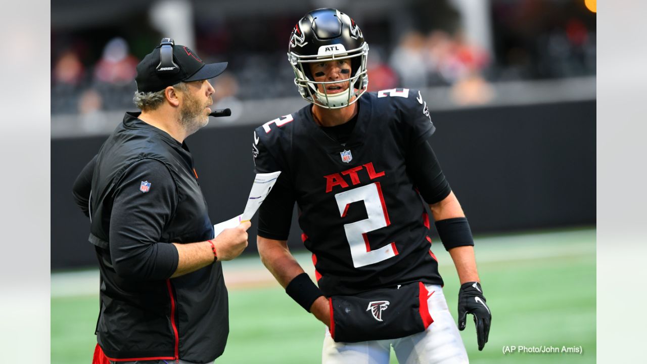 First look: Recently acquired quarterback Matt Ryan holds his new  Indianapolis Colts jersey following his trade away from the Atlanta Falcons.