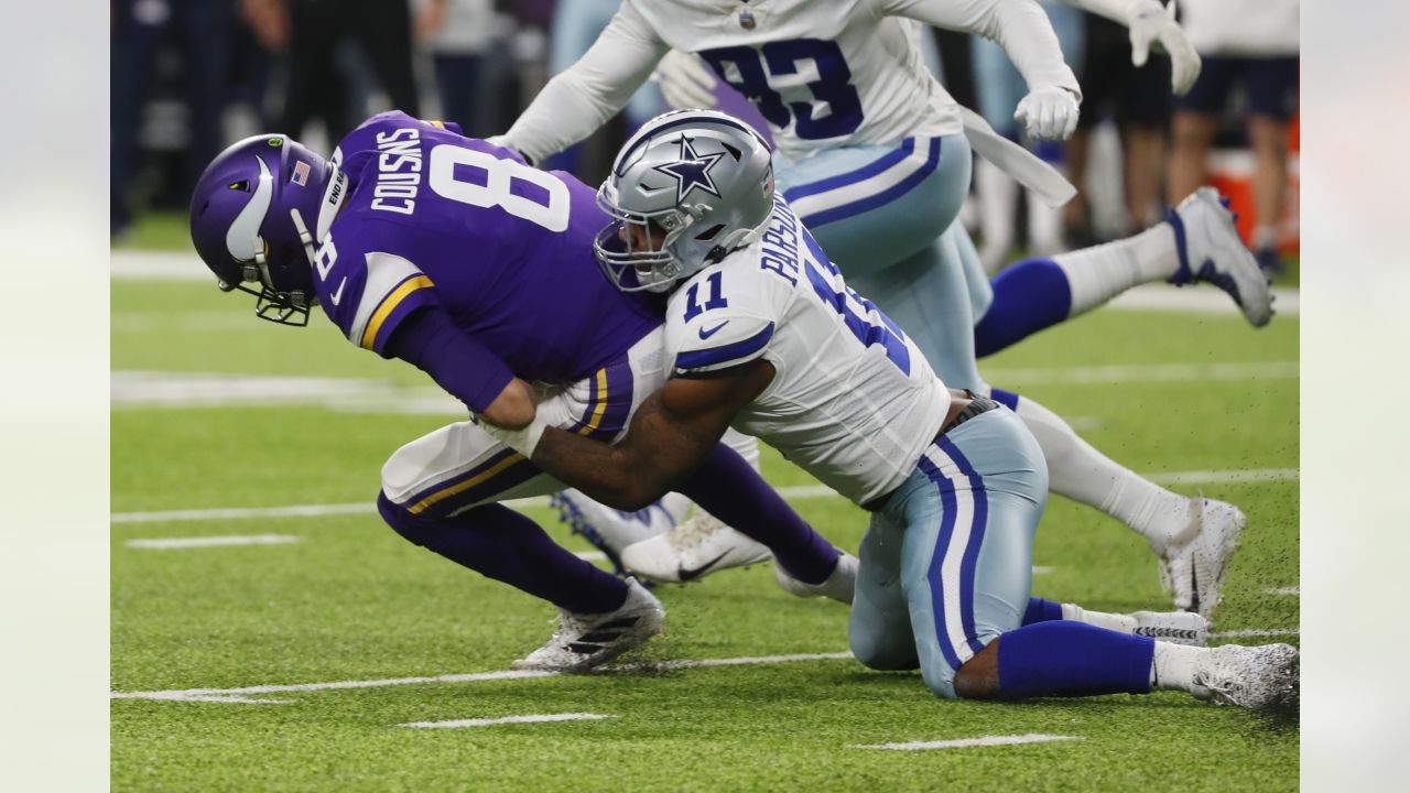 Minnesota Vikings quarterback Kirk Cousins (8) is tackled by Dallas Cowboys outside linebacker Micah Parsons (11) during the first half of an NFL football game, Sunday, Oct. 31, 2021, in Minneapolis. (AP Photo/Bruce Kluckhohn)