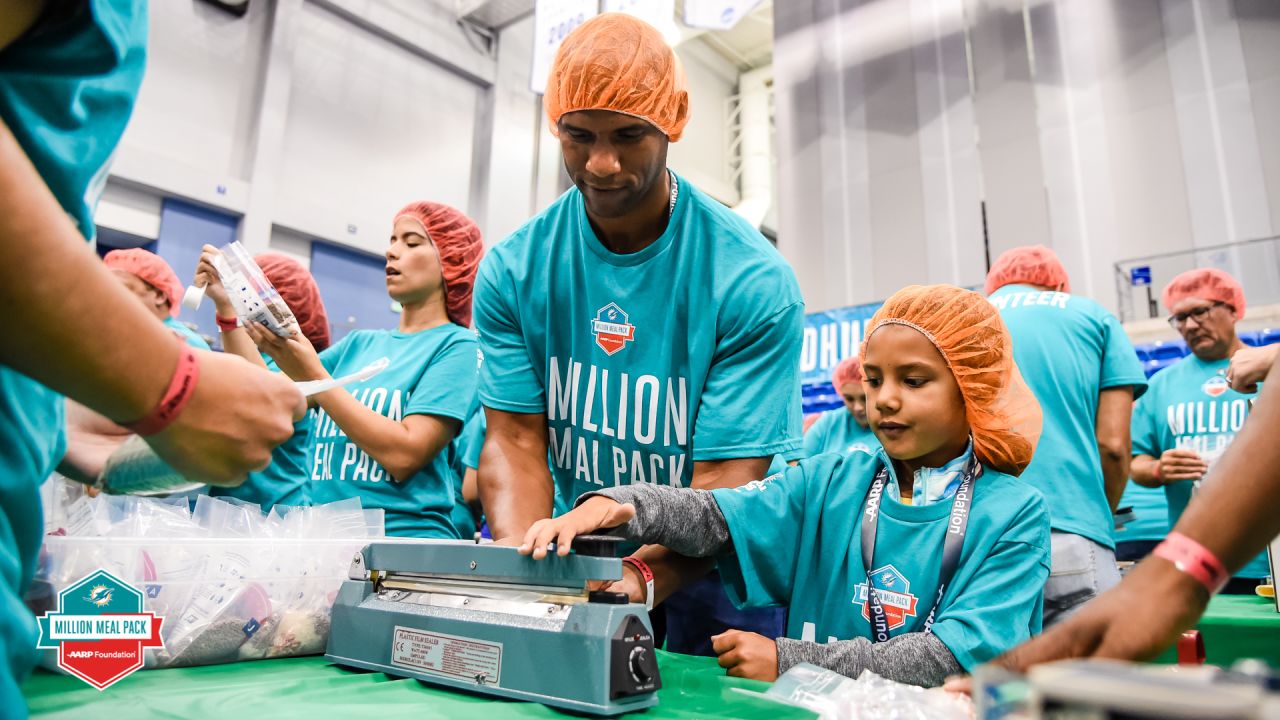 Miami Dolphins, AARP Foundation Host Fifth Annual Million Meal Pack on  NSU's Fort Lauderale /Davie Campus