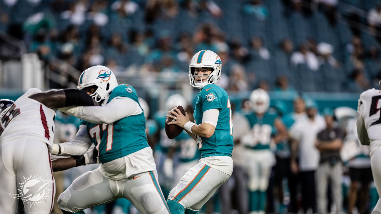 Miami Dolphins quarterback Mike White looks for an open receiver during the  first half of a preseason NFL football game against the Atlanta Falcons,  Friday, Aug. 11, 2023, in Miami Gardens, Fla. (