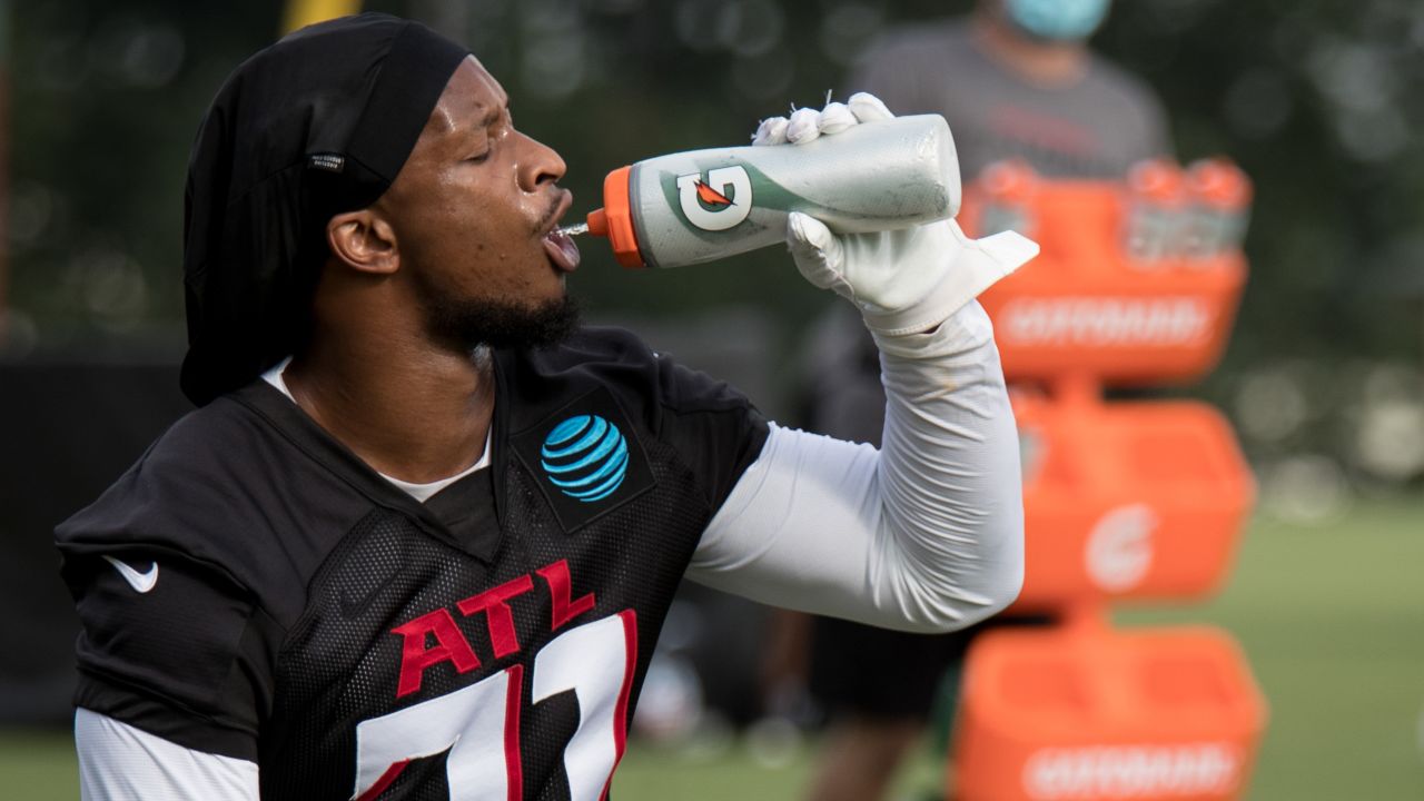 Atlanta Falcons linebacker Mykal Walker (3) and cornerback A.J. Terrell  (24) talk during a break in NFL football training camp at the team's  practice facility in Flowery Branch, Ga., Wednesday, Aug. 10