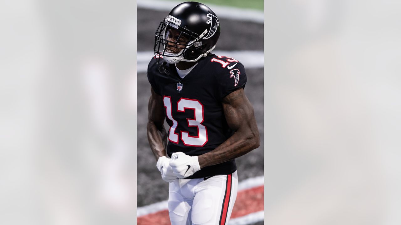 Atlanta Falcons wide receiver Christian Blake #13 runs out of the tunnel  during pregame against the …