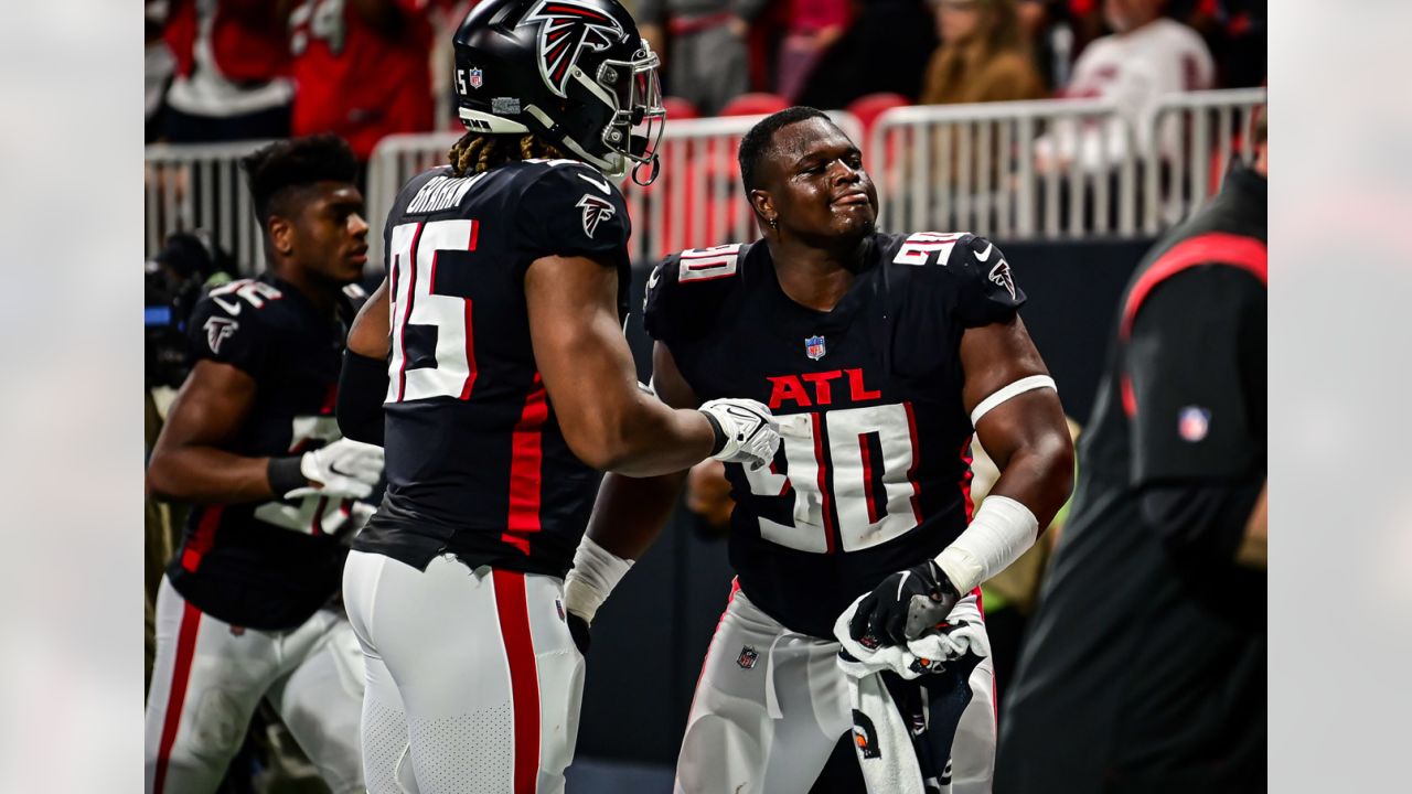 Atlanta Falcons defensive end Marlon Davidson (90) celebrates a touchdown  with outside linebacker Steven Means (55) during the first half of an NFL  football game against the Tampa Bay Buccaneers, Sunday, Dec.