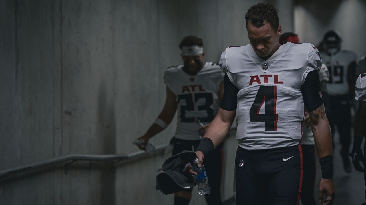 First look: Atlanta Falcons newly signed quarterback Marcus Mariota holding  his Falcons jersey, speaking with media