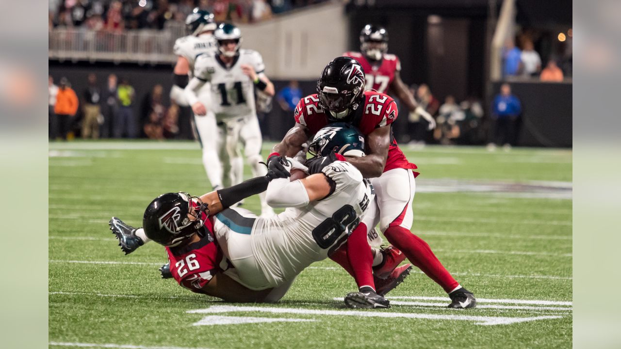 Philadelphia Eagles tight end Zach Ertz (86) is stopped for a first down by Atlanta  Falcons free safety Isaiah Oliver (26) Atlanta Falcons strong safety Keanu  Neal (22) during the second half