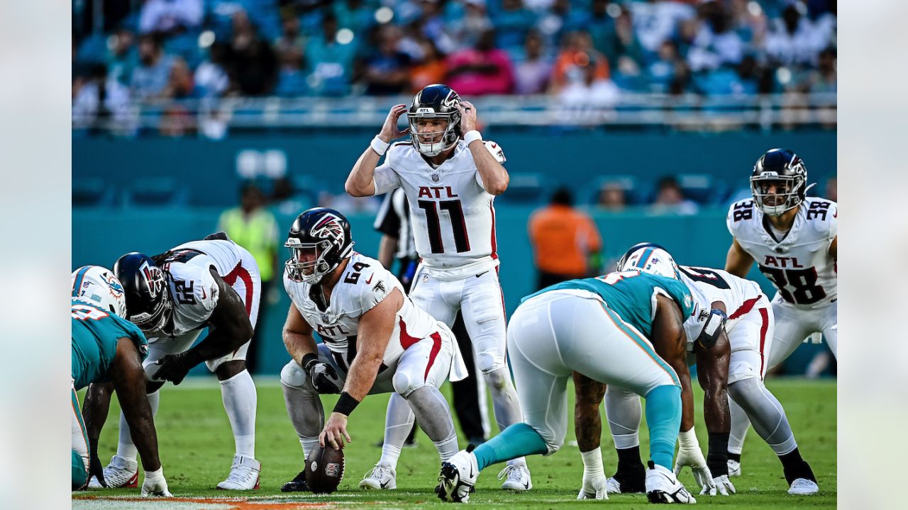 Atlanta Falcons quarterback Logan Woodside (11) runs with the ball against  the Miami Dolphins during an NFL pre-season football game, Friday, Aug. 11,  2023, in Miami Gardens, Fla. (AP Photo/Doug Murray Stock